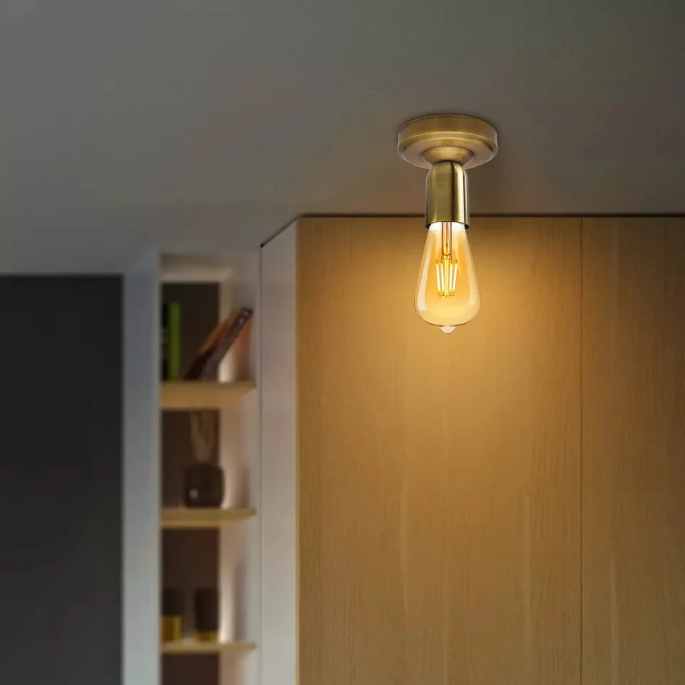 Vintage metal semi flush E27 ceiling light fitting with industrial design and round ceiling rose, shown installed indoors