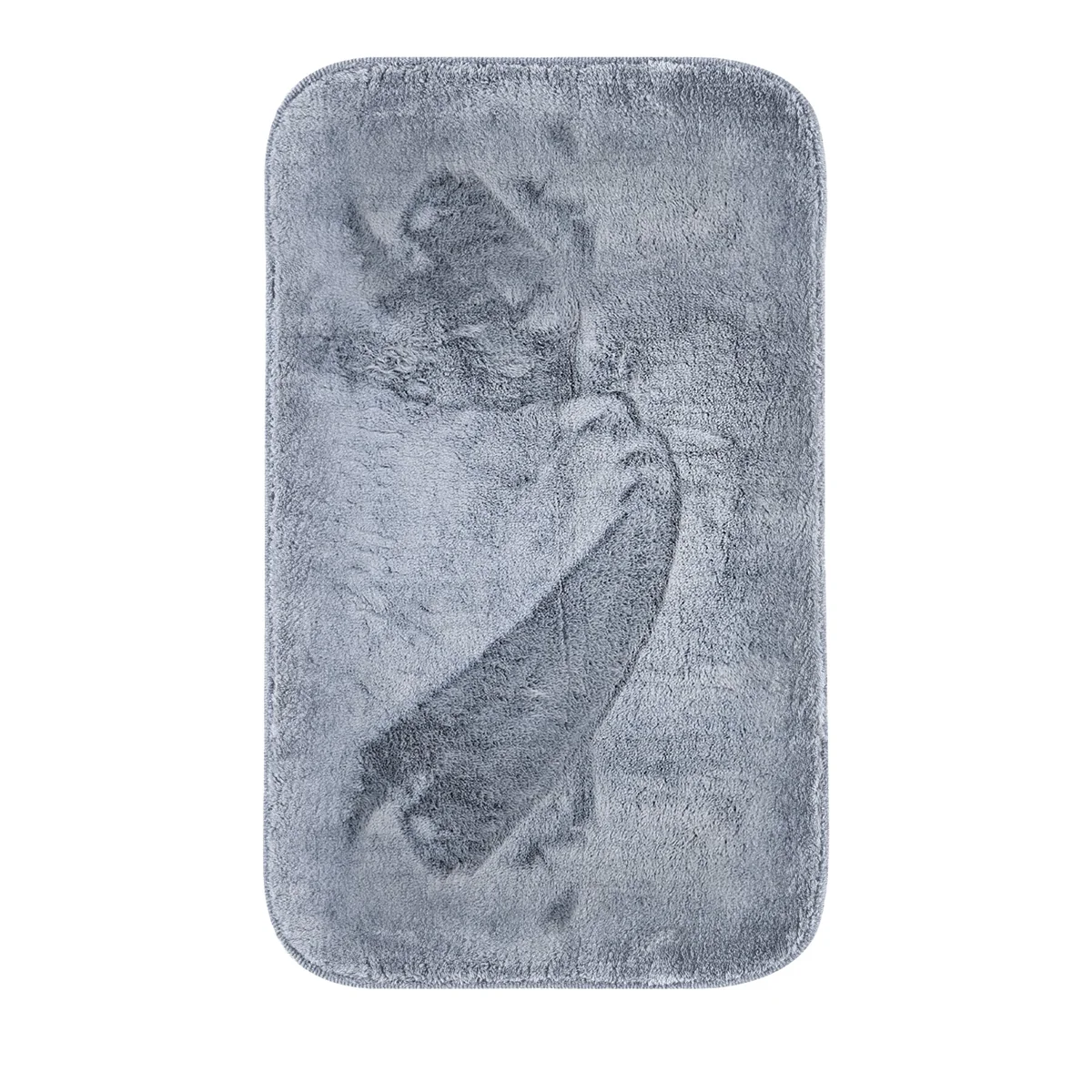 Soft fluffy doormat in grey microfiber with plush texture and non-slip backing on wooden floor in a home hallway