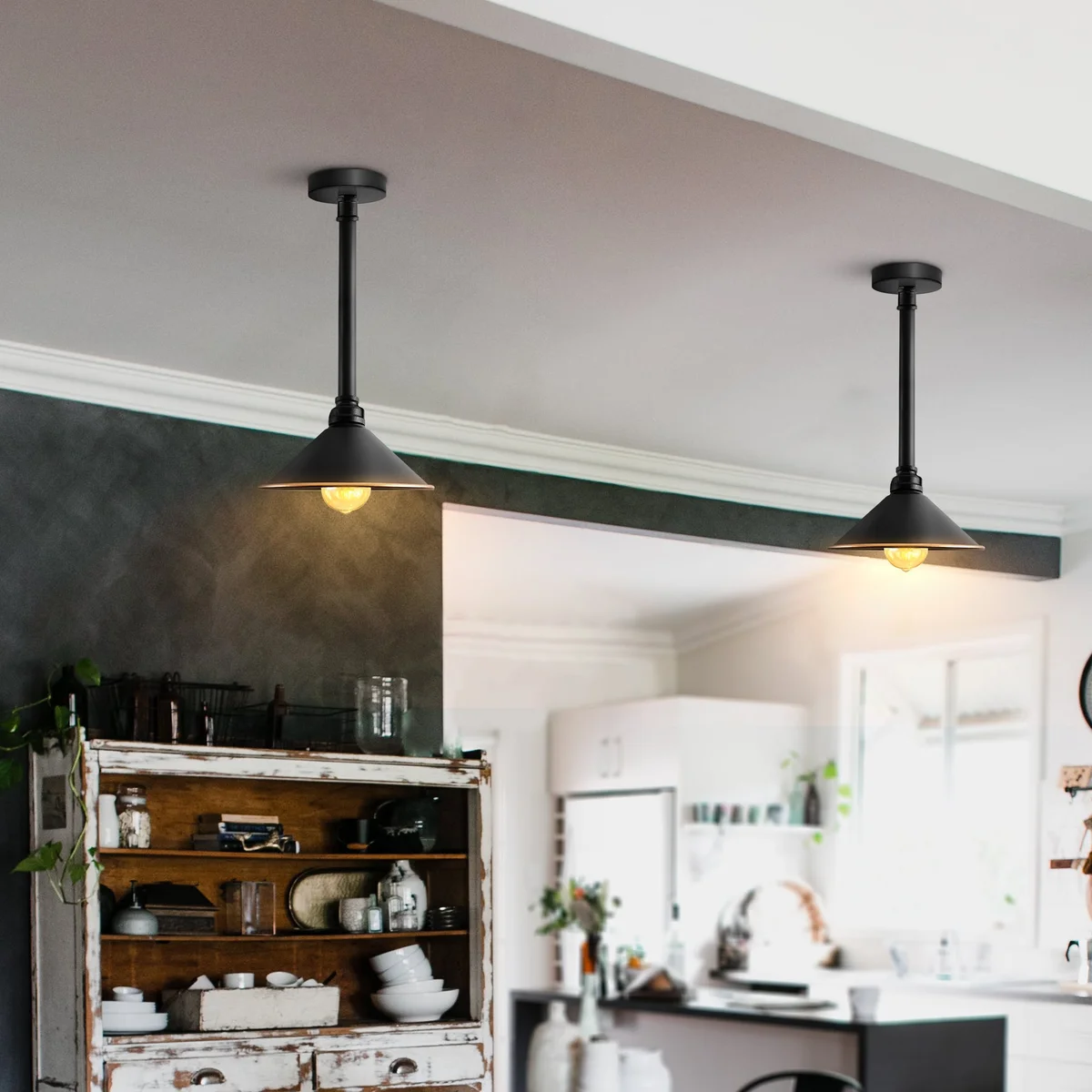 Black vintage industrial long pipe pendant light with cone shade hanging from ceiling mount against white background