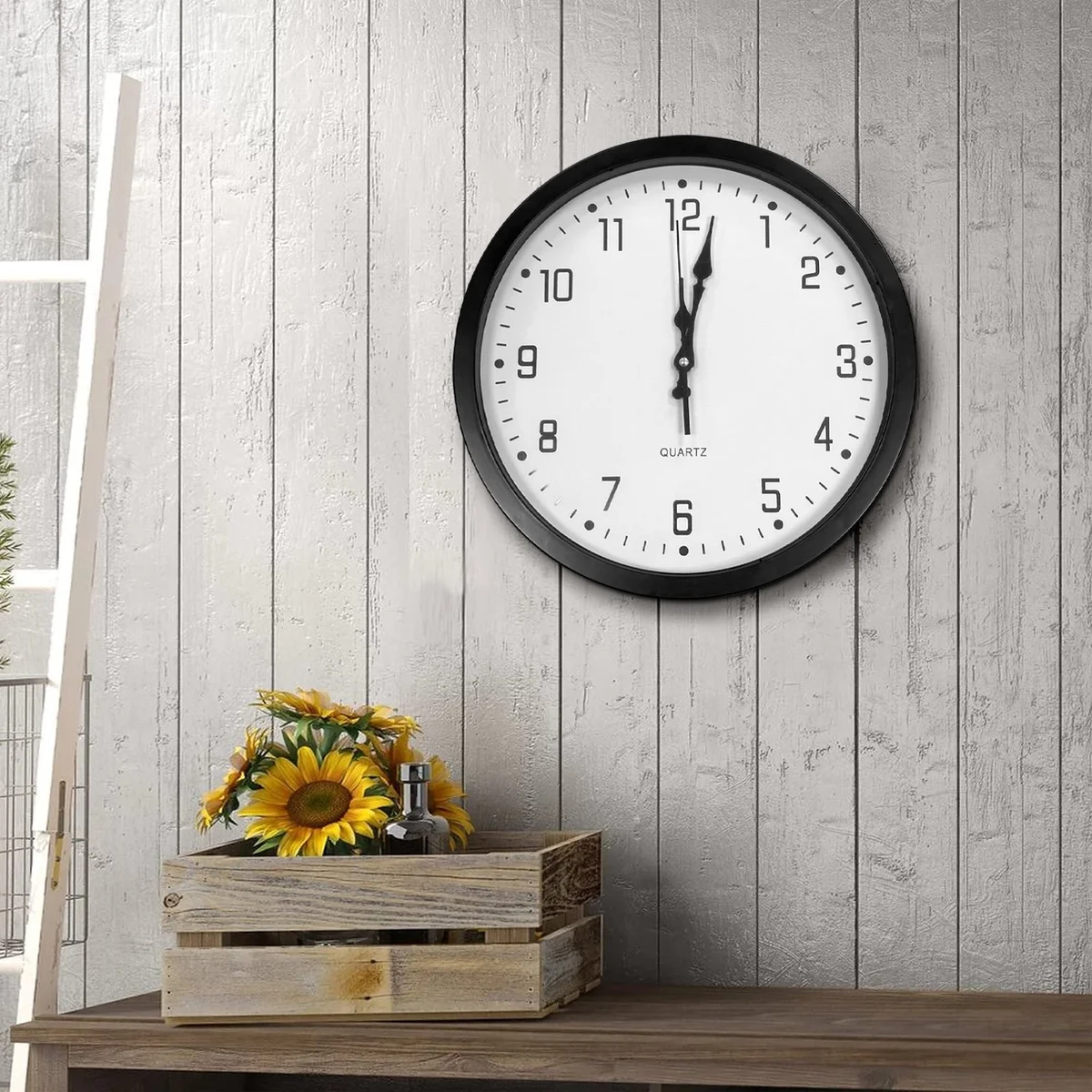 Modern round wall clock with black plastic frame, white face, large black numbers, and analog display, 35cm diameter