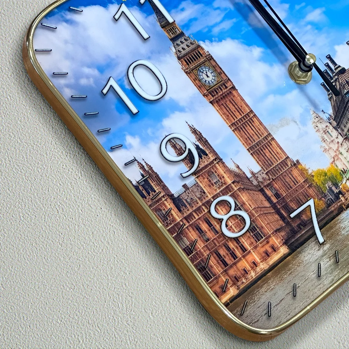 Rectangular plastic London Big Ben wall clock with large analog numbers displayed on a modern indoor wall.