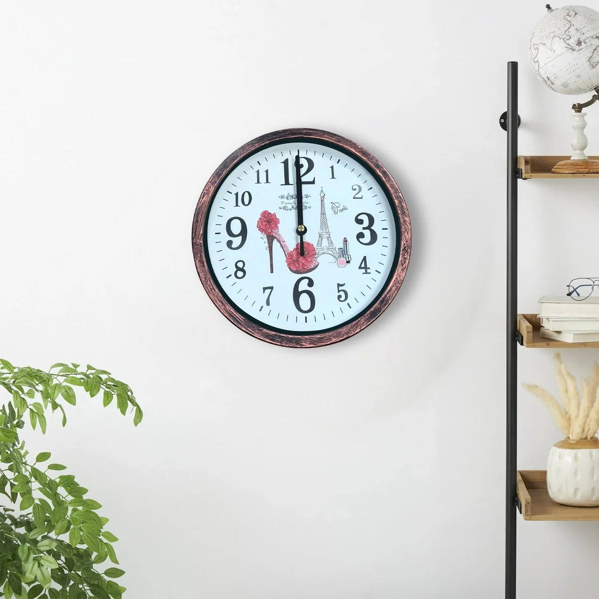 Round shabby chic wall clock with distressed wooden patchwork frame and vintage analog face on white background
