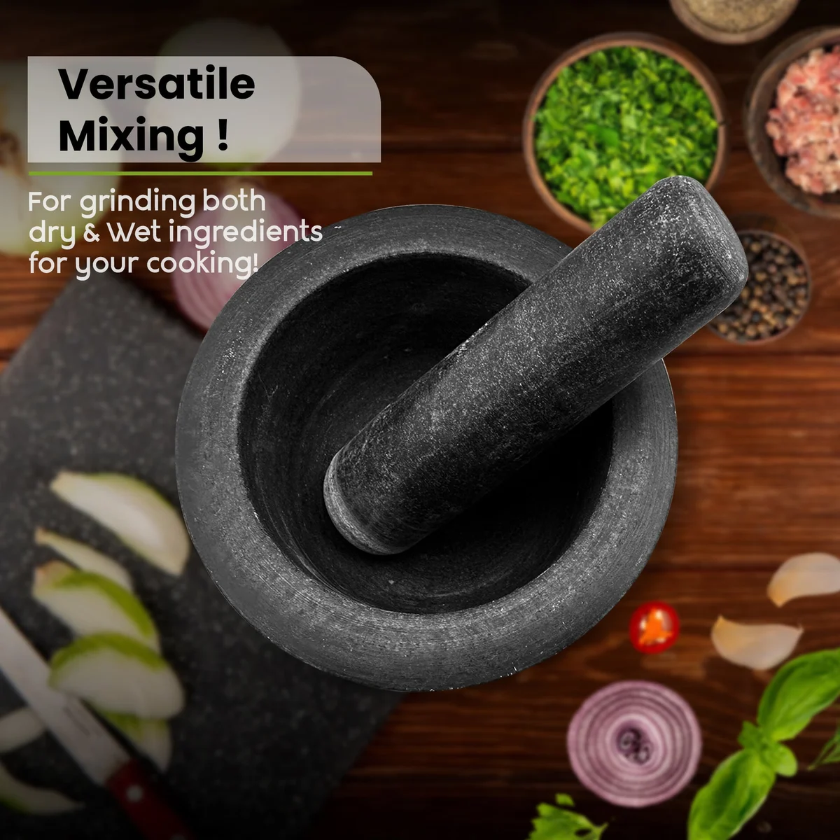 Black granite mortar and pestle set with polished finish, showing pestle resting inside mortar, kitchen countertop background