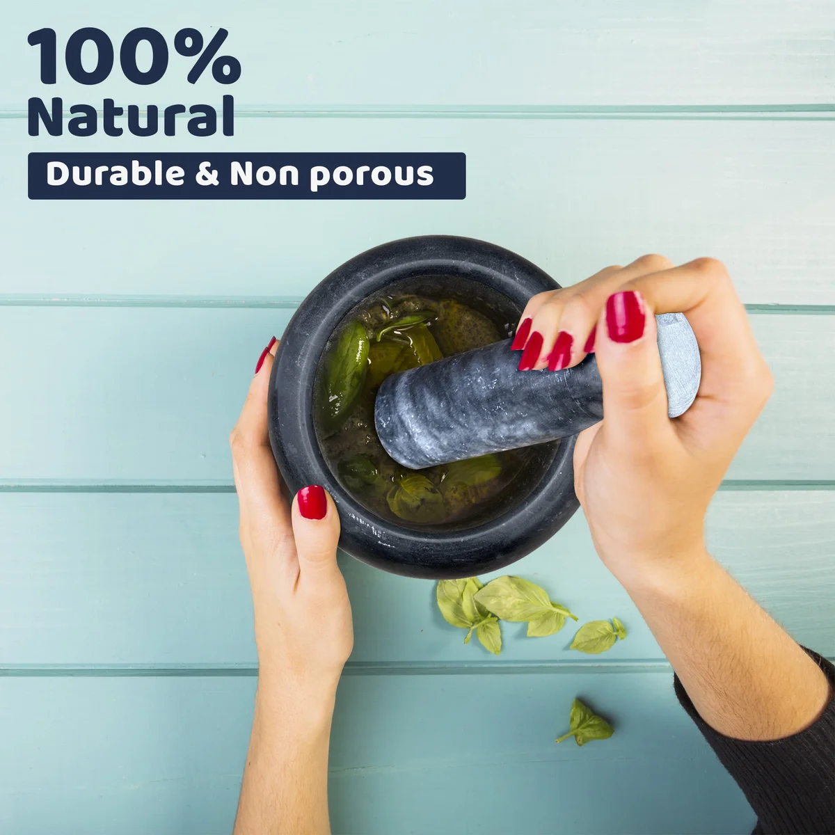Polished marble herb crusher grinder with pestle and mortar, hand‑grip handle for kitchen use.