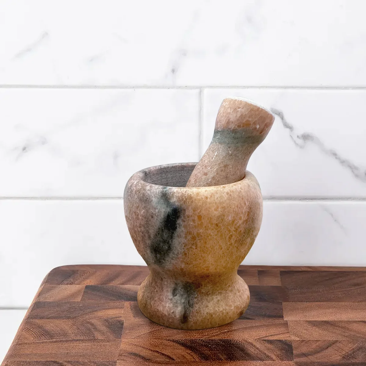 Polished marble herb crusher grinder with pestle and mortar, 11cm × 11cm, easy‑grip handle for grinding dry and wet herbs.