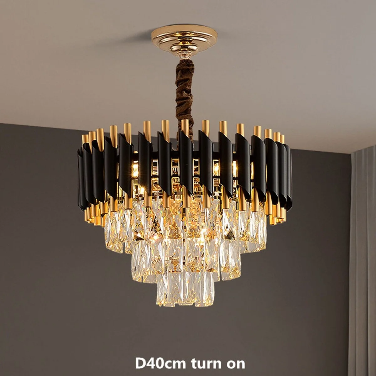 Modern crystal black and gold chandelier with matching wall lights showcasing metal crystal lighting design in a hotel hall setting
