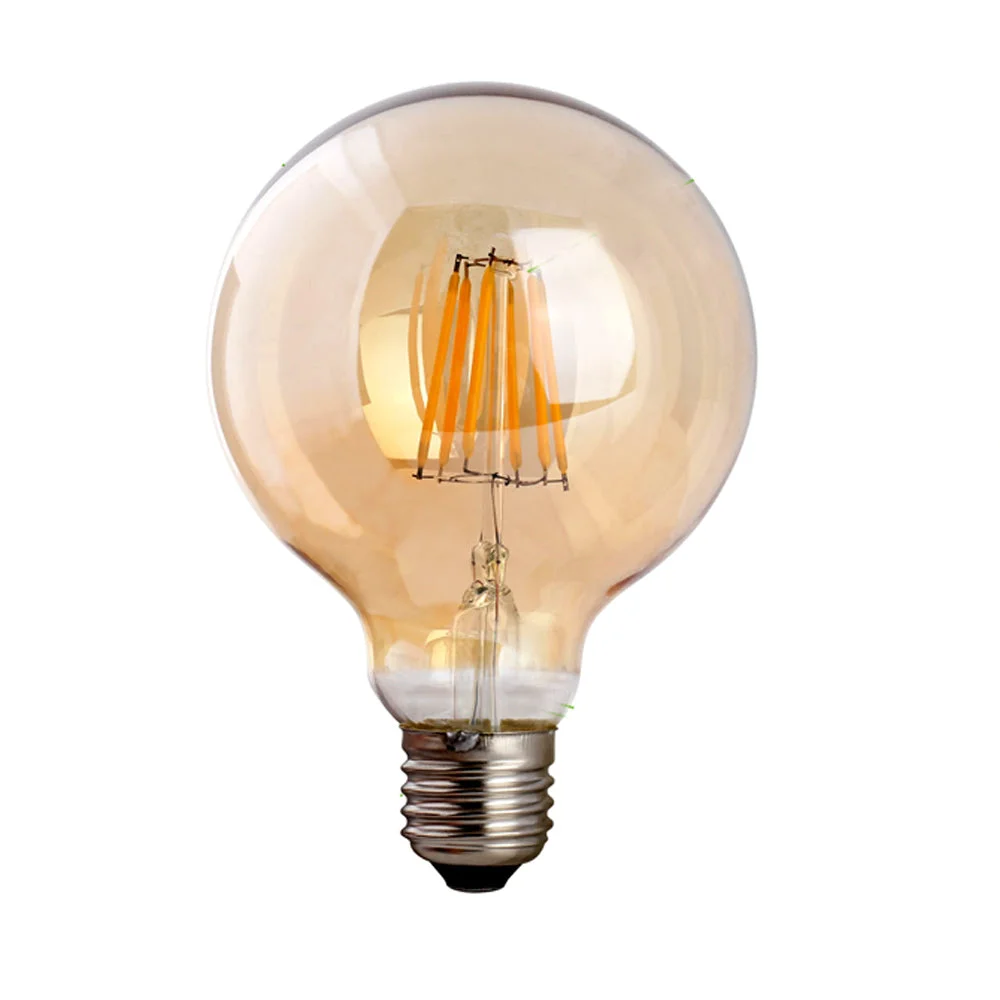 Amber glass vintage G95 8W LED light bulb with E27 screw base glowing warmly on a white background