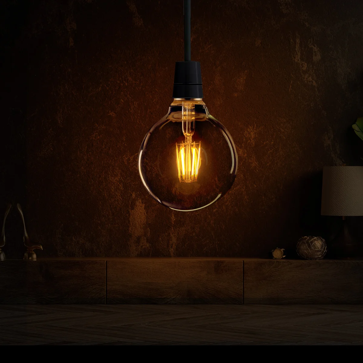Amber glass vintage dimmable LED bulb G95 with E27 base glowing softly against a dark background