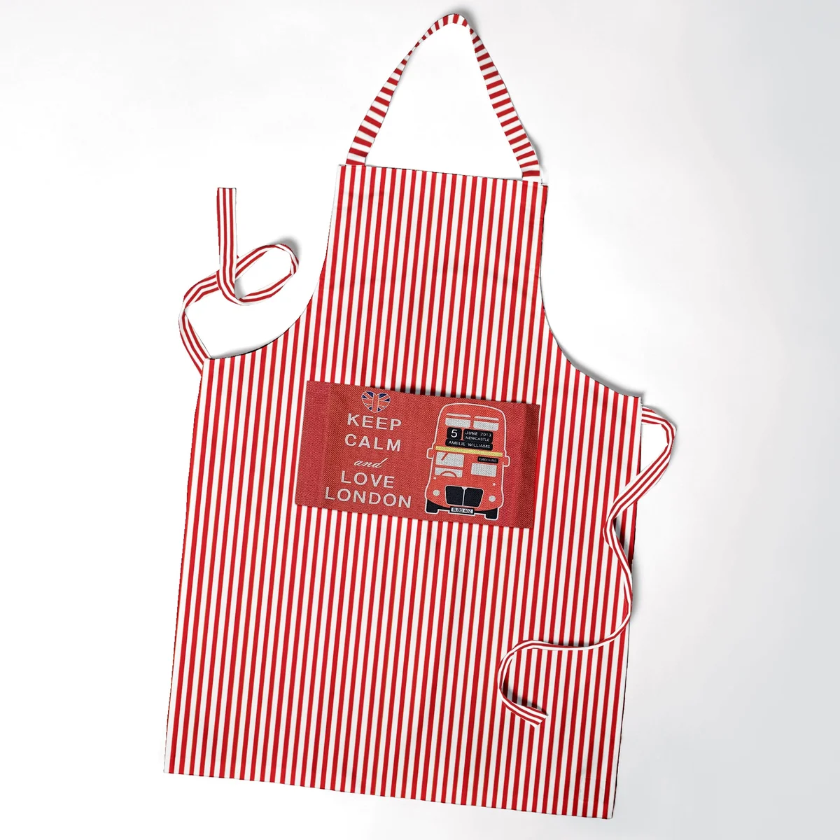 Cotton cooking apron in modern style with adjustable neck strap and large front pocket for utensils and phone storage