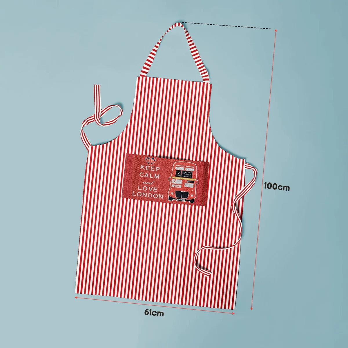 Cotton cooking apron in modern style with adjustable neck strap and spacious front pocket for utensils and phone storage