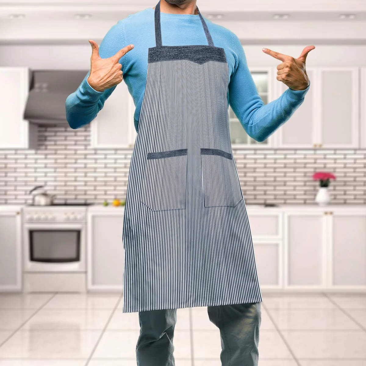 Woman wearing adjustable kitchen apron with double pockets, cotton fabric, tied neck and long waist straps visible