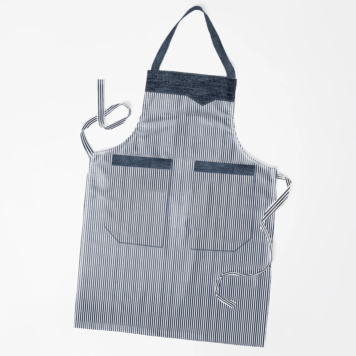 Unisex cooking apron in cotton with double pockets, adjustable necktie and long waist straps shown flat on white background