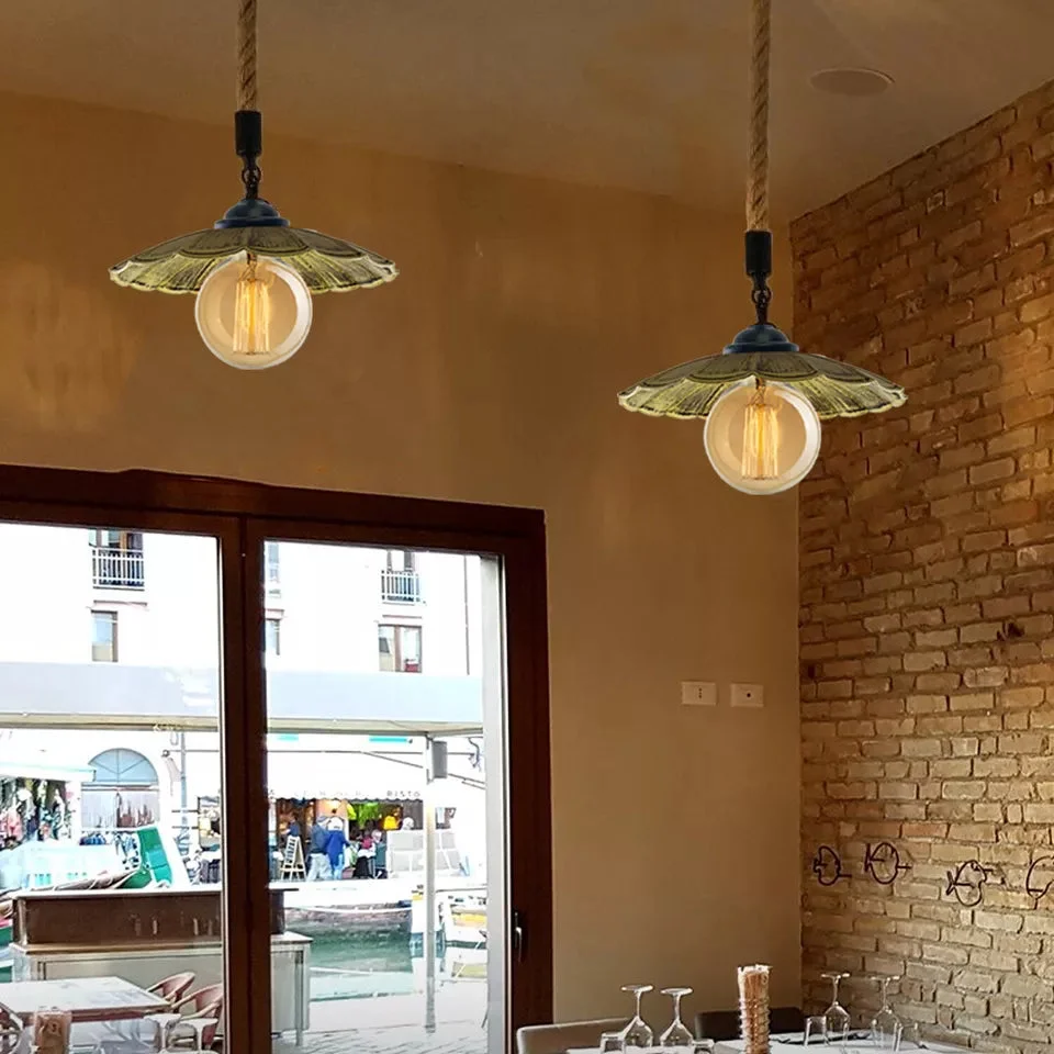 Modern hanging light with black metal shade and hemp rope cord, showcasing industrial vintage style pendant design