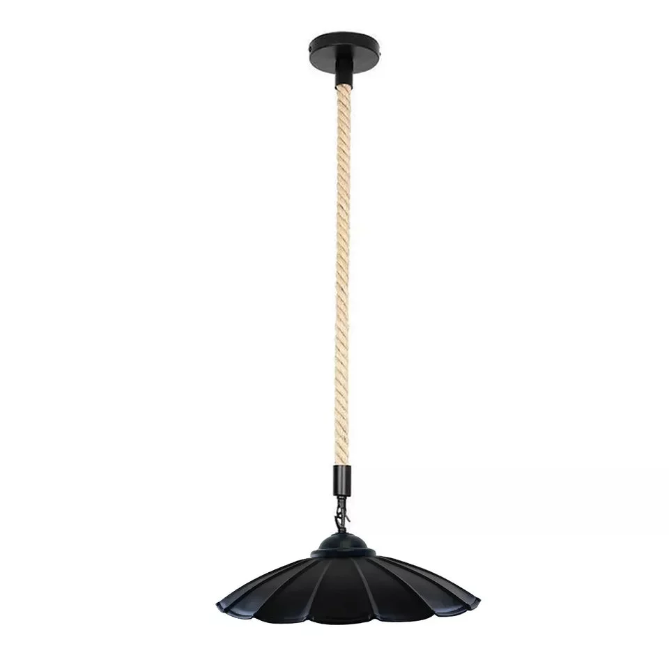 Vintage industrial cord pendant light with metal shade, hemp rope cord, and black iron finish hanging indoors