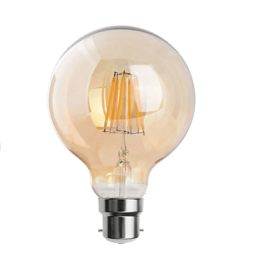 Vintage G95 B22 warm white LED bulb with visible filament, dimmable, 8W, glowing softly on a black background