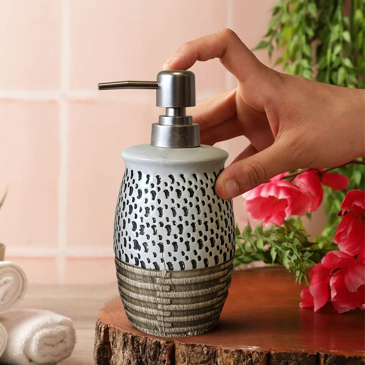 White ceramic bathroom lotion dispenser with manual pump, part of 4-piece modern bathroom accessories set