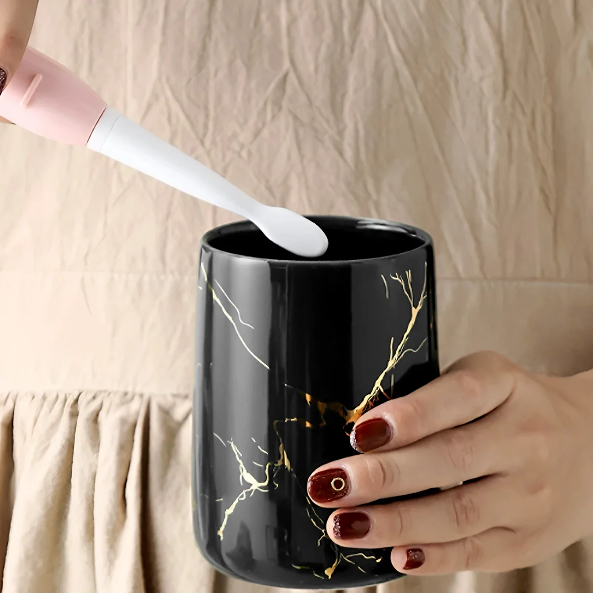 White modern ceramic bathroom set with soap dispenser, toothbrush holder, tumbler, and soap dish on white background