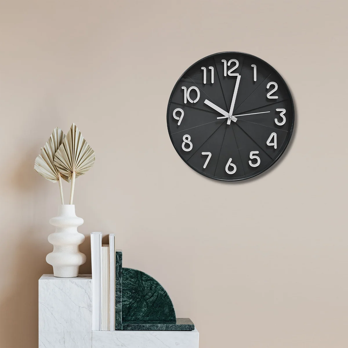Round black silent wall clock with white numbers and hands on black background, plastic body, tempered glass face, no ticking noise