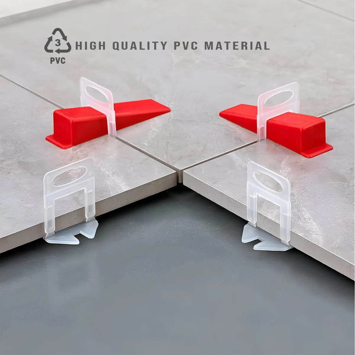 100 yellow, red, and orange PVC tile leveling wedges arranged for wall tile installation, reusable and durable tools