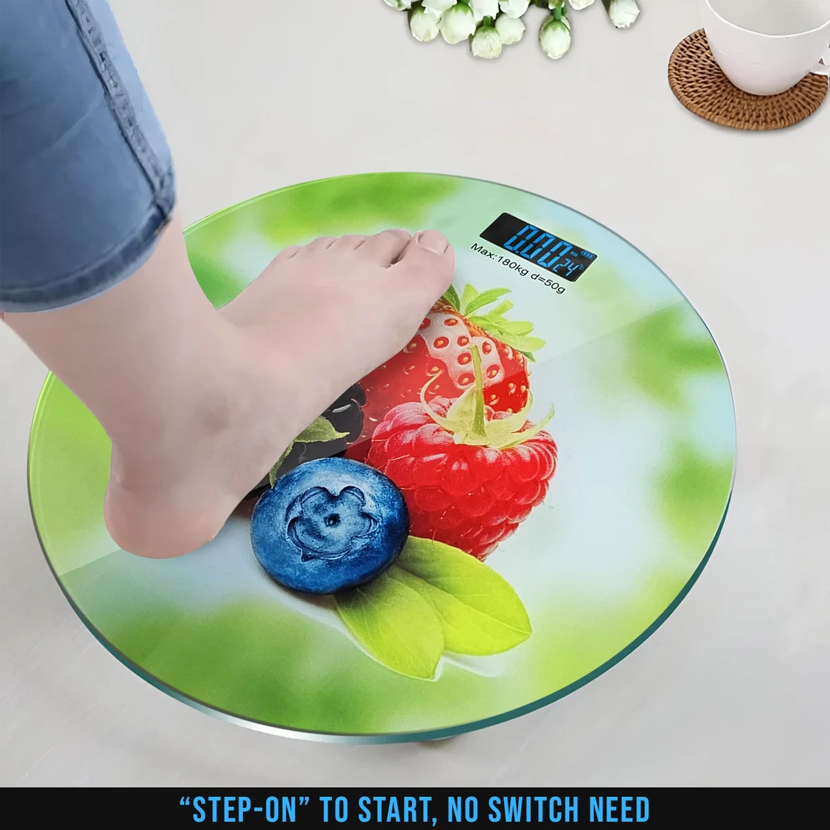 Round digital scales weight loss with printed design, LCD backlit display, and sleek glass surface on white background