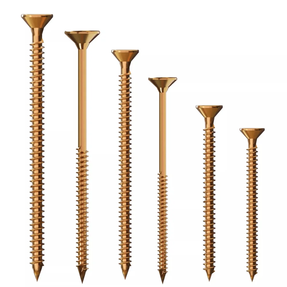 Close-up of flat head yellow passivated screws with sharp pointed tips and deep knurled threads on a white background