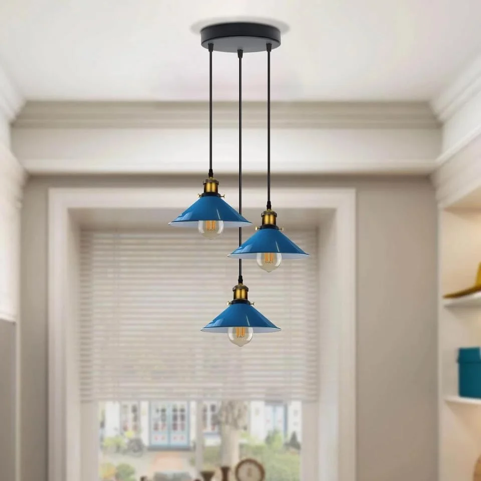 Industrial 3 light pendant with three metal cone shades hanging from round ceiling base, vintage retro style lighting fixture