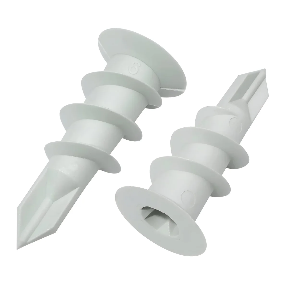 Close-up of white nylon wall anchors and self drilling gypsum board screws in a 100 pack for drywall fixings