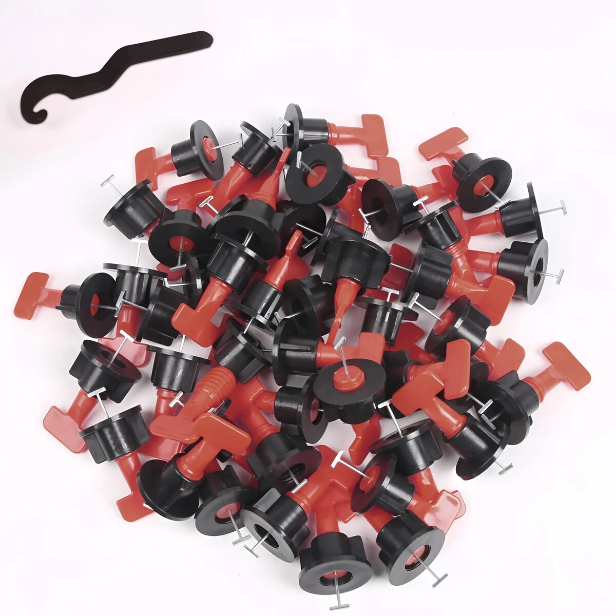 Black and red reusable tile leveling system clips with T-shaped design arranged on a white background
