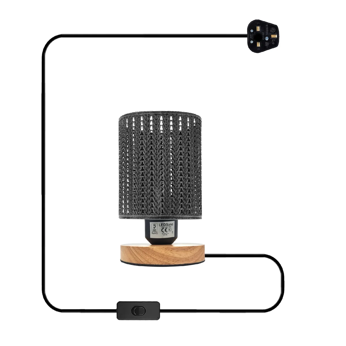Industrial table lamp with metal wire cage shade and natural wood base on a white background