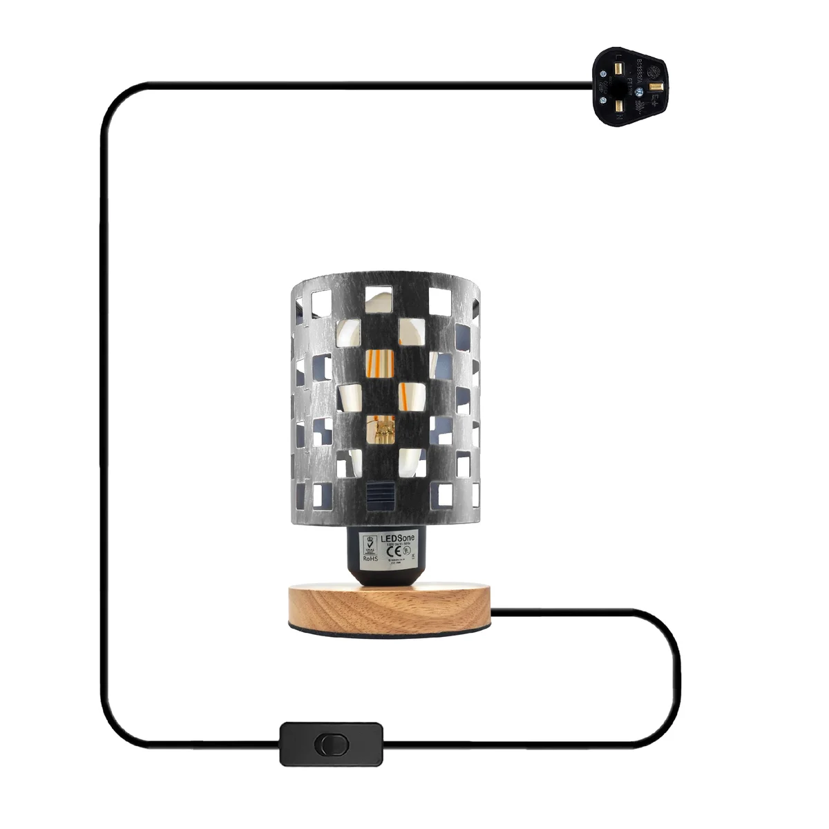 Antique brass indoor plug-in lamp with metal wire cage and natural wood base on a wooden surface