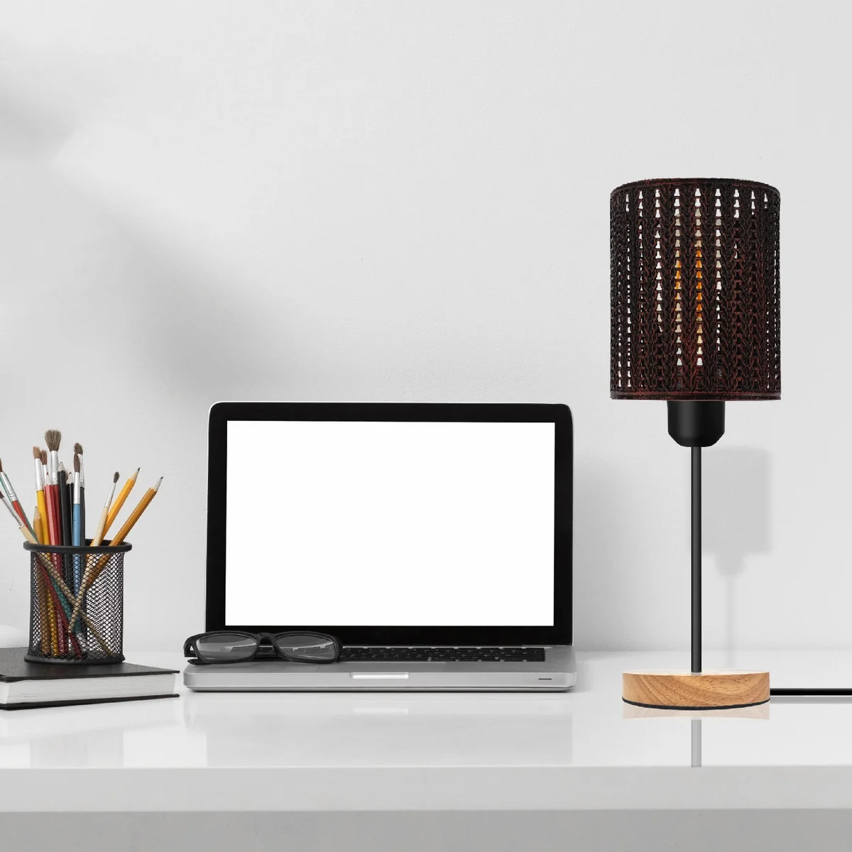 Industrial table lamp with metal wire cage shade and natural wood stand, suitable for indoor use with E27 bulbs