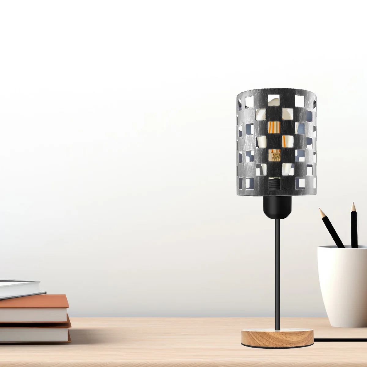 Industrial wooden base lamp with metal wire cage and E27 socket on an adjustable cable against white background