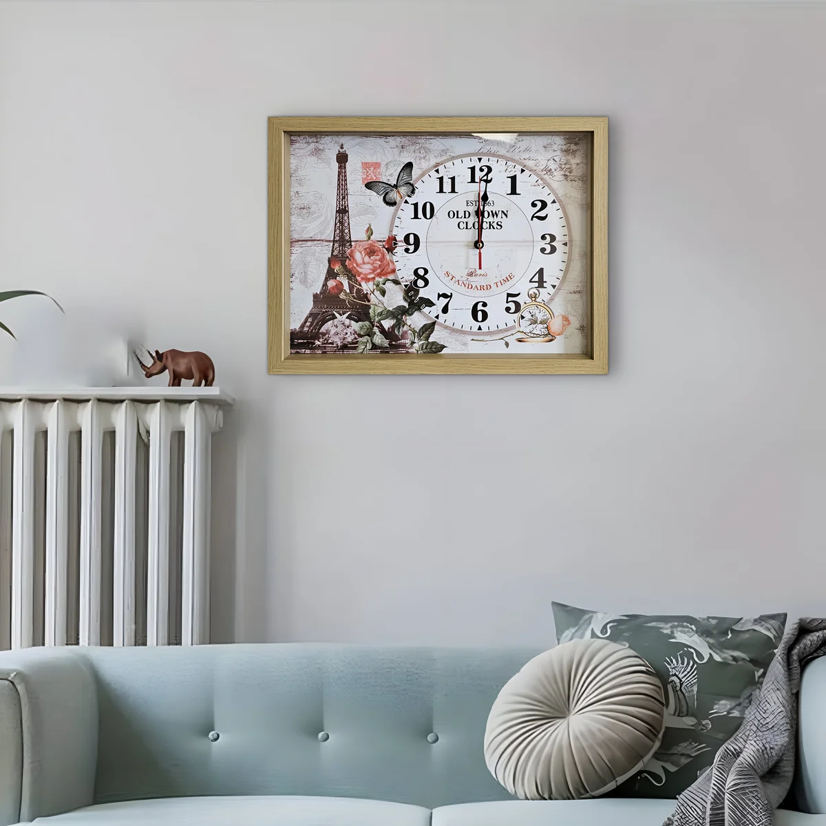 Rectangular wooden wall clock with framed Eiffel Tower illustration and large clear numbers on smooth wood surface