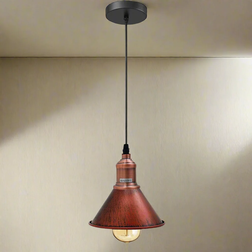 Matte black industrial ceiling light with brushed brass lamp holder hanging against white background