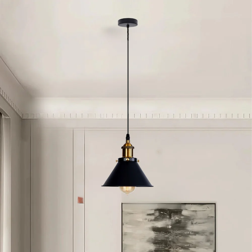 Matte black industrial dimmable ceiling light with brushed brass lamp holder hanging in modern living room setting