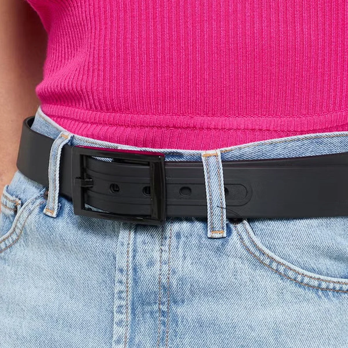 Two silicone candy colour belts in vibrant pink and blue with lightweight acrylic pin buckles on white background