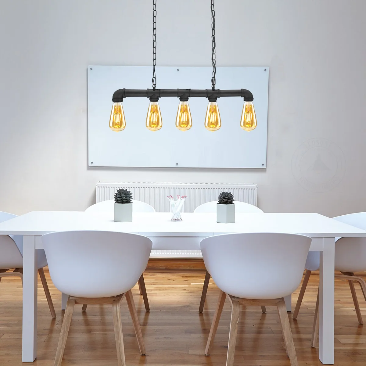 Five-light vintage industrial lighting pendant with adjustable chains and black metal pipe design hanging from ceiling