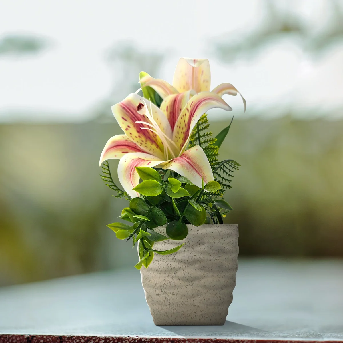 Two artificial lily flowers in pots with vibrant silk petals, ideal for table decorations and indoor use
