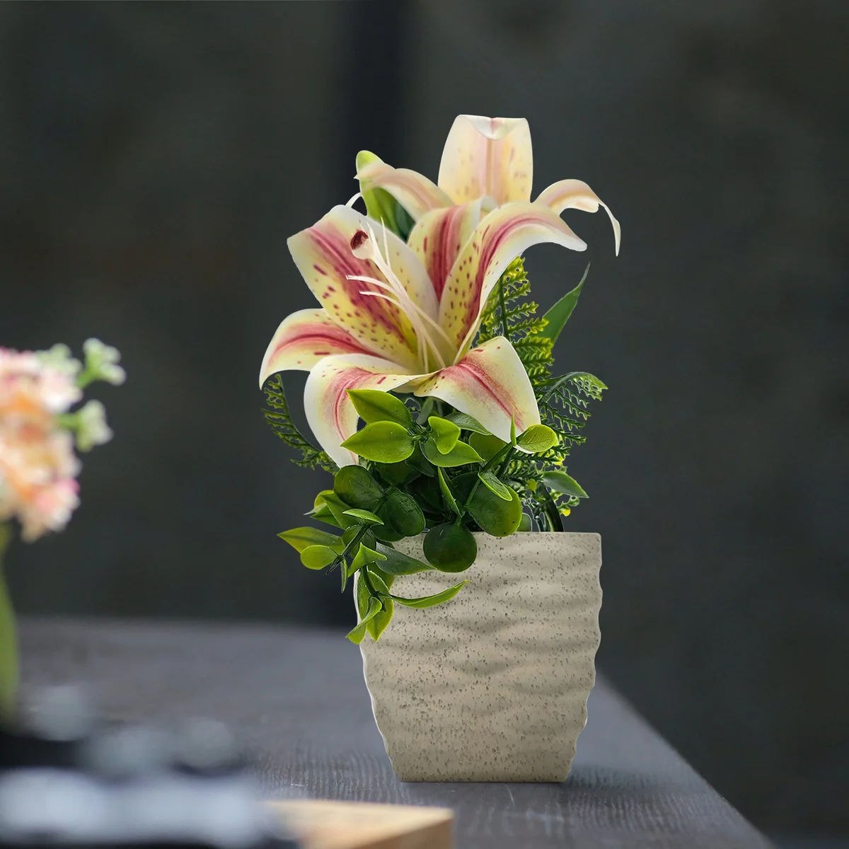 Two long lasting artificial flowers in pots with vibrant silk lily blooms for table decoration