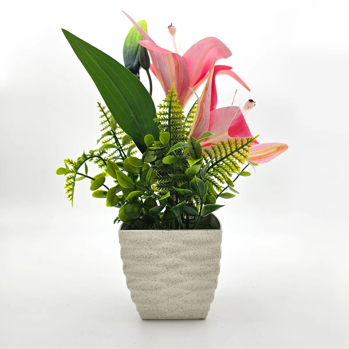 Two artificial lily flowers in white with green leaves in small pots, ideal for table decorations indoors