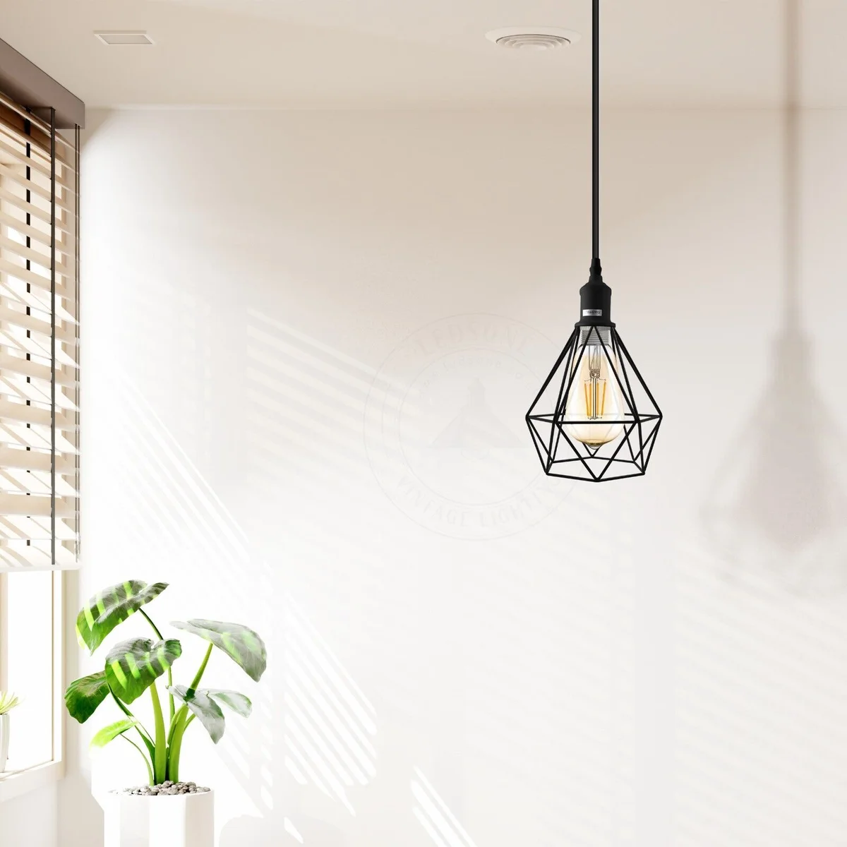 Vintage industrial metal cage dimmable indoor pendant light with black finish hanging from ceiling cable