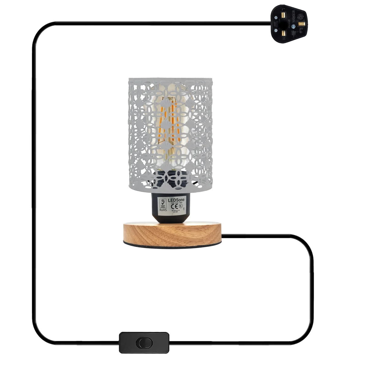 Vintage wire cage lamp with barrel-shaped metal cage and wooden stand, plugged in with visible British 3-pin plug and switch