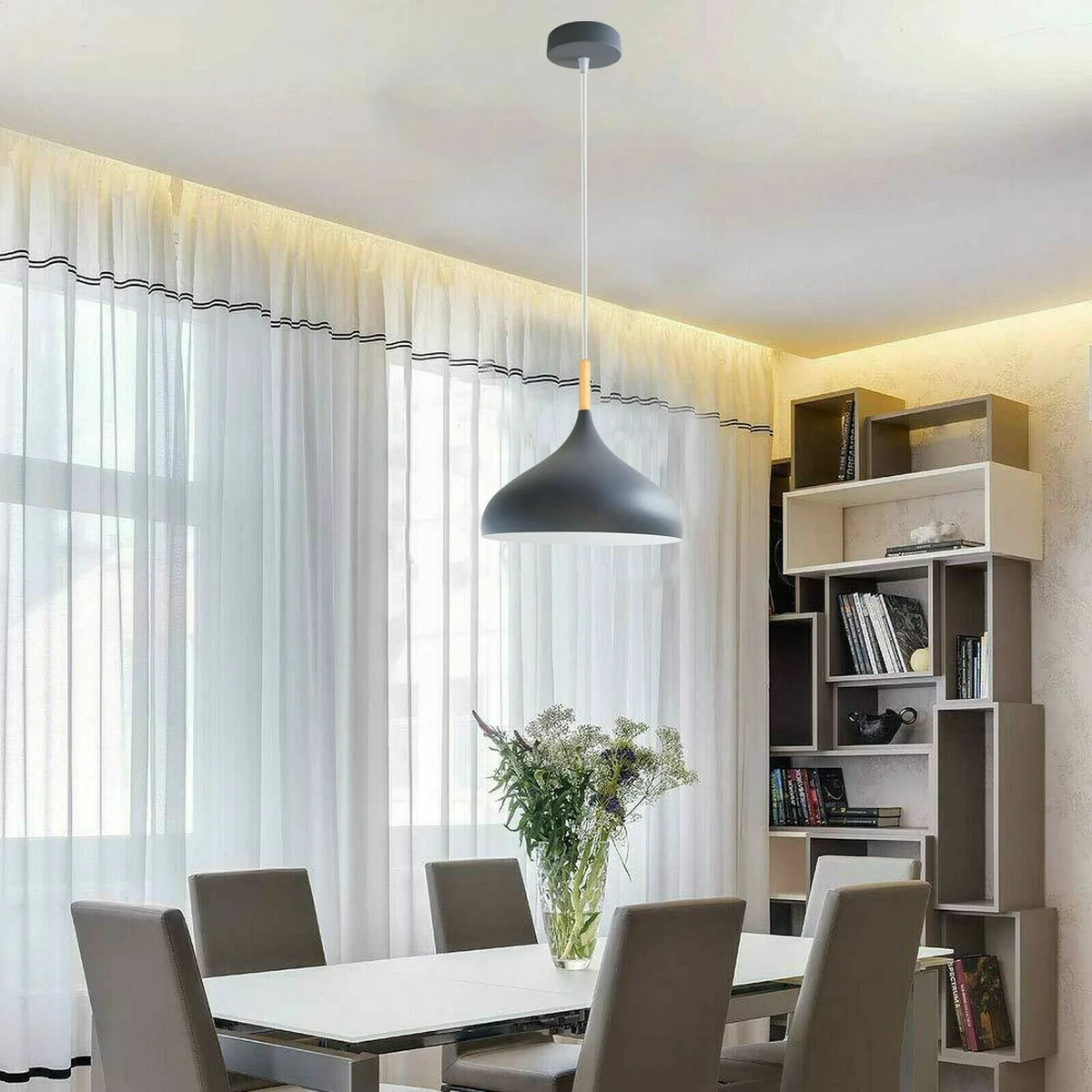 Modern ceiling pendant light with sleek red metal dome shade and adjustable base hanging from ceiling