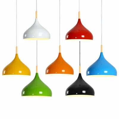 Adjustable sloped ceiling light with sleek metal shade in red, angled base, and 95cm cable hanging over kitchen island