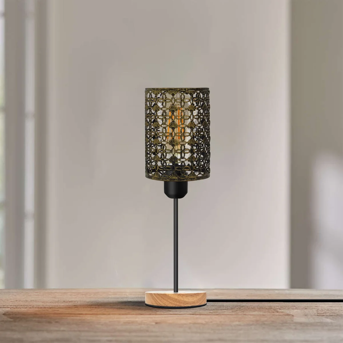Metal cage lamp with wooden base on a bedside table, featuring a barrel cage design and E27 bulb socket