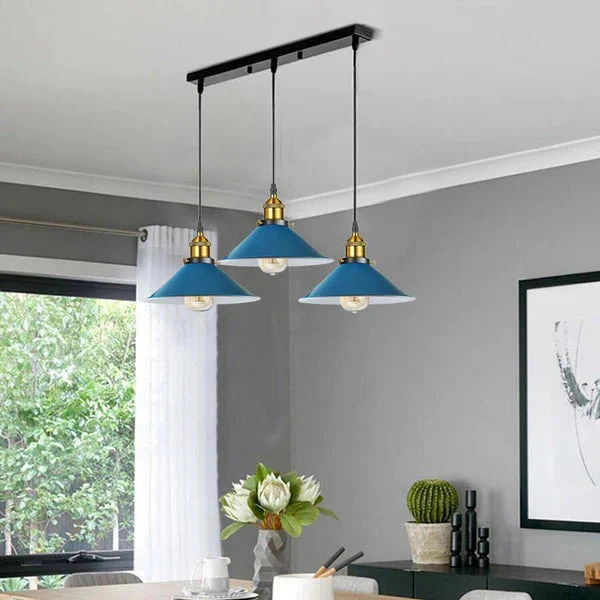White industrial pendant light with three adjustable wide metal cone shades on a rectangular ceiling mount