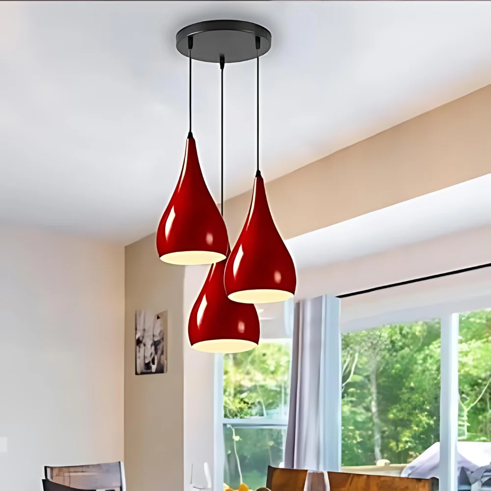 Three black teardrop-shaped shades hanging at different heights from a multi teardrop ceiling light fixture