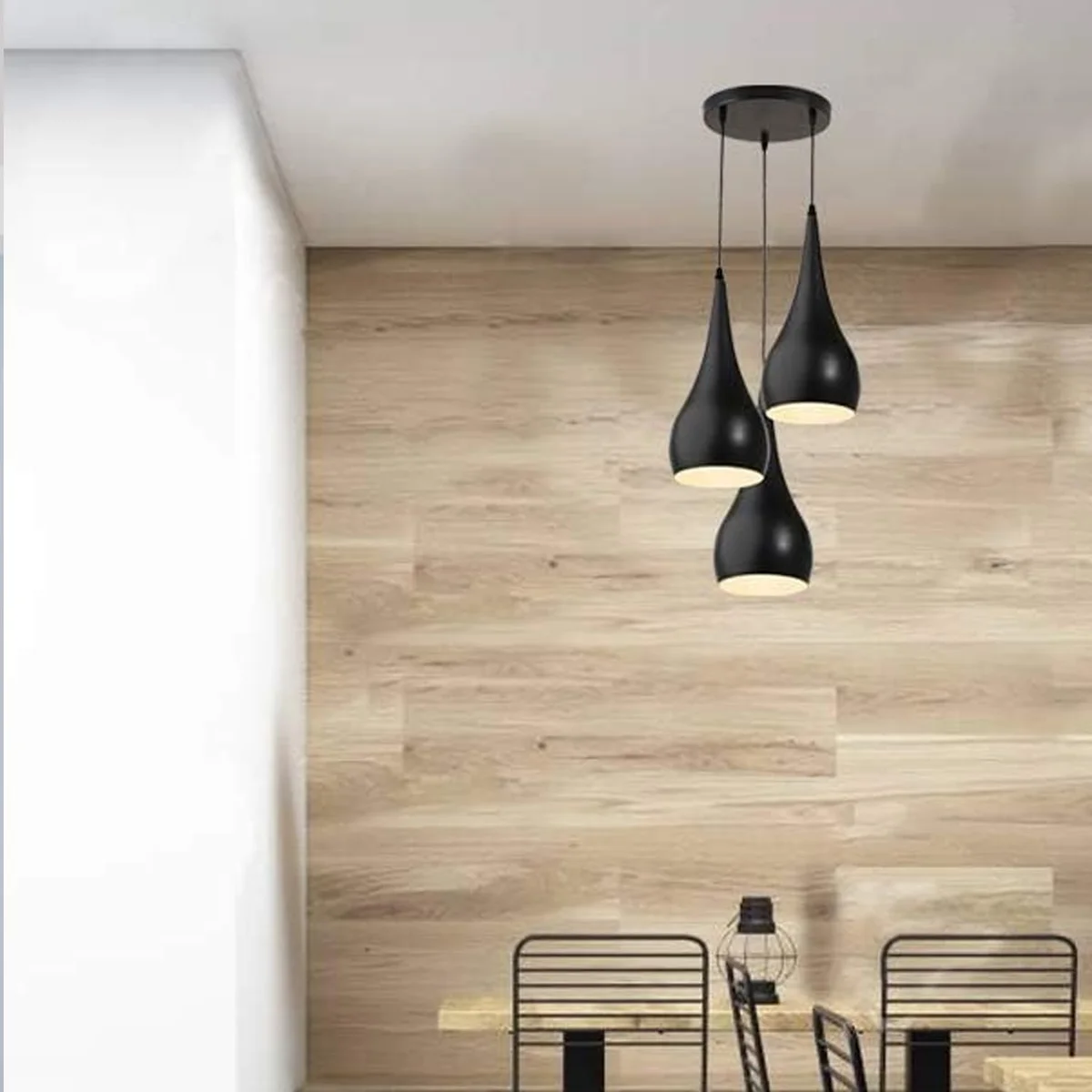 Black multi teardrop ceiling light with three hanging shades at varied heights, modern design for dining or living spaces