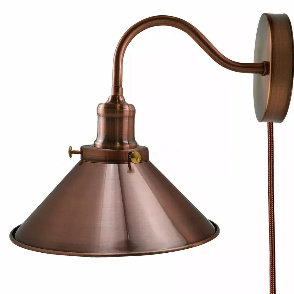 Vintage Nordic metal plug in wall light with 2m cable and dimmer switch mounted on a white wall