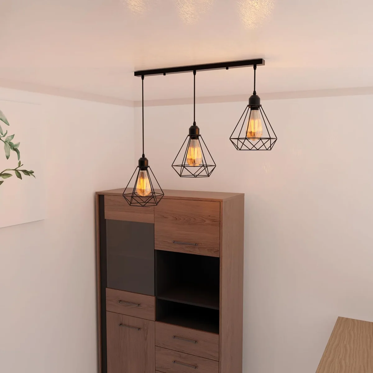 Black industrial adjustable pendant lamp with three diamond wire cage shades hanging from ceiling fixture